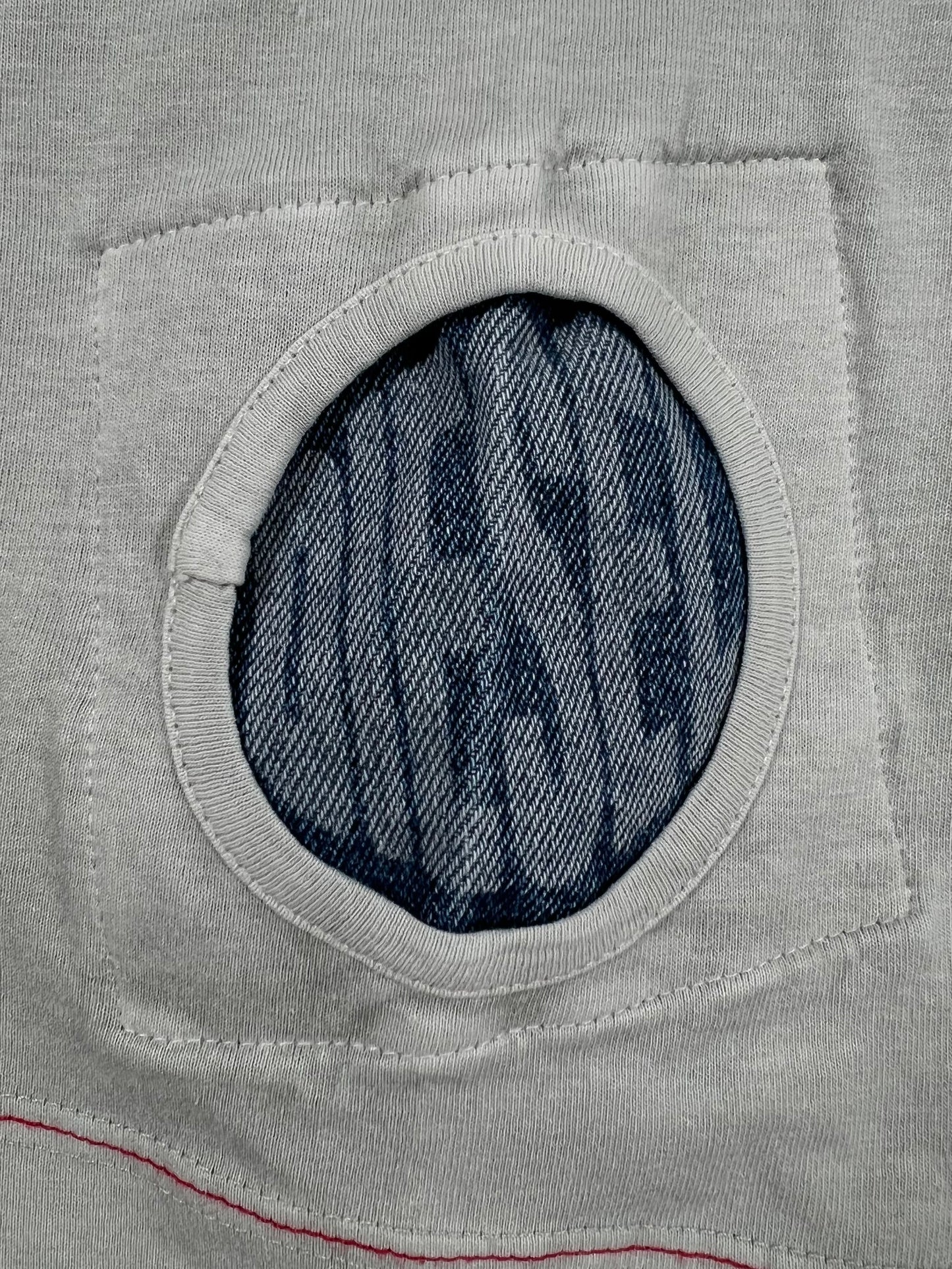A grey pocket with the word DIESEL T-JUST-LOCK T-SHIRT PALE/GREY on it.