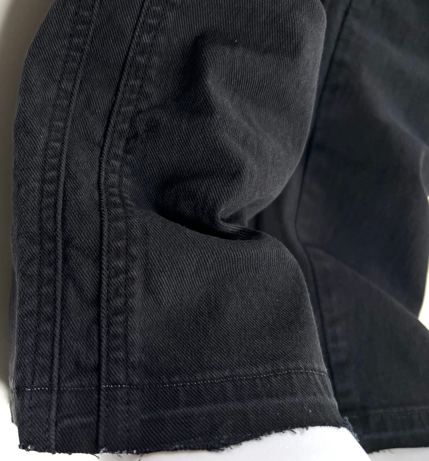A close up of a pair of REPRESENT M07064 STRAIGHT LEG DENIM BLACK jeans.