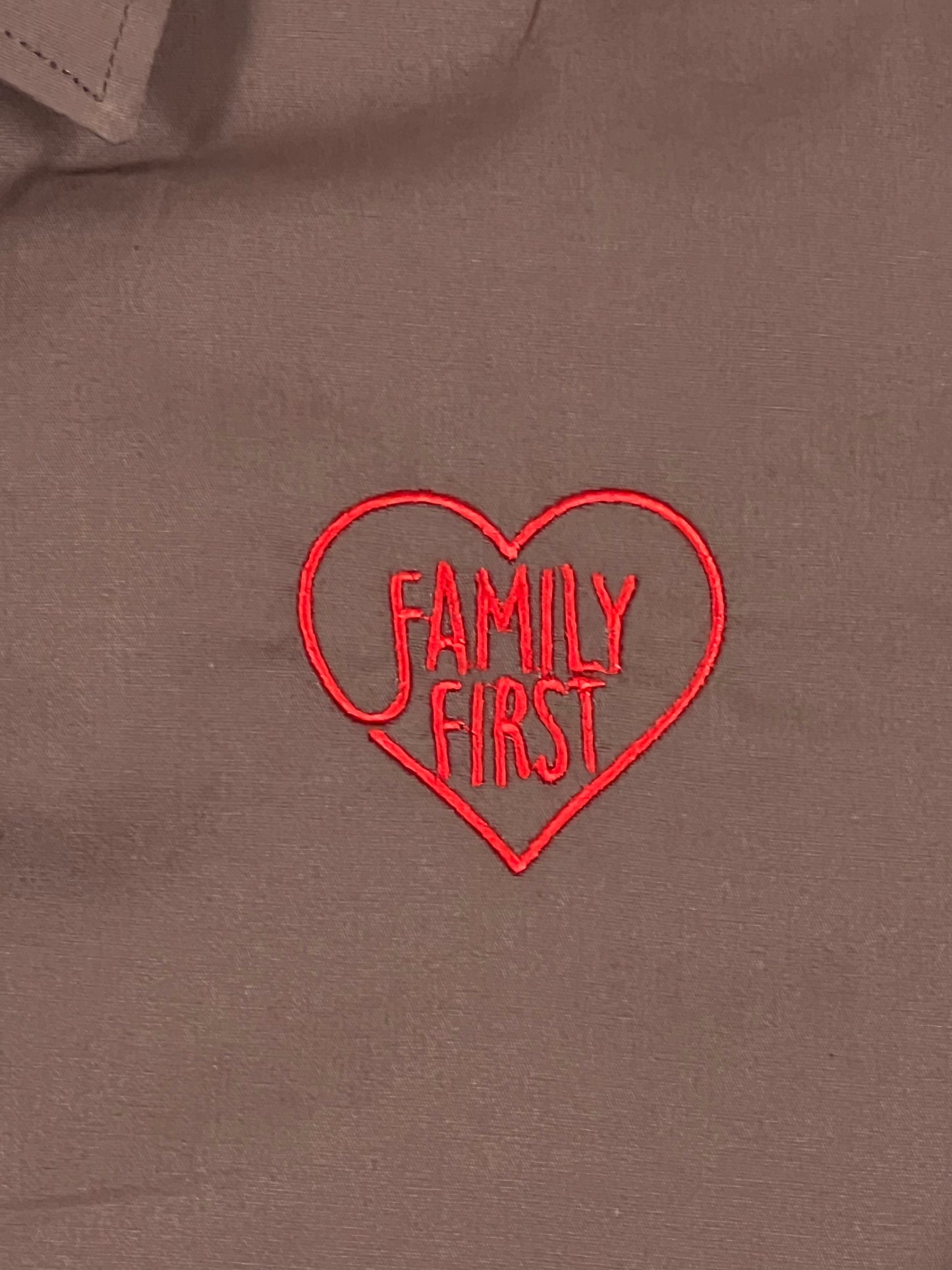 A long sleeve shirt with the FAMILY FIRST SHF2201 SHIRT REGULAR HEART BROWN embroidered on it.