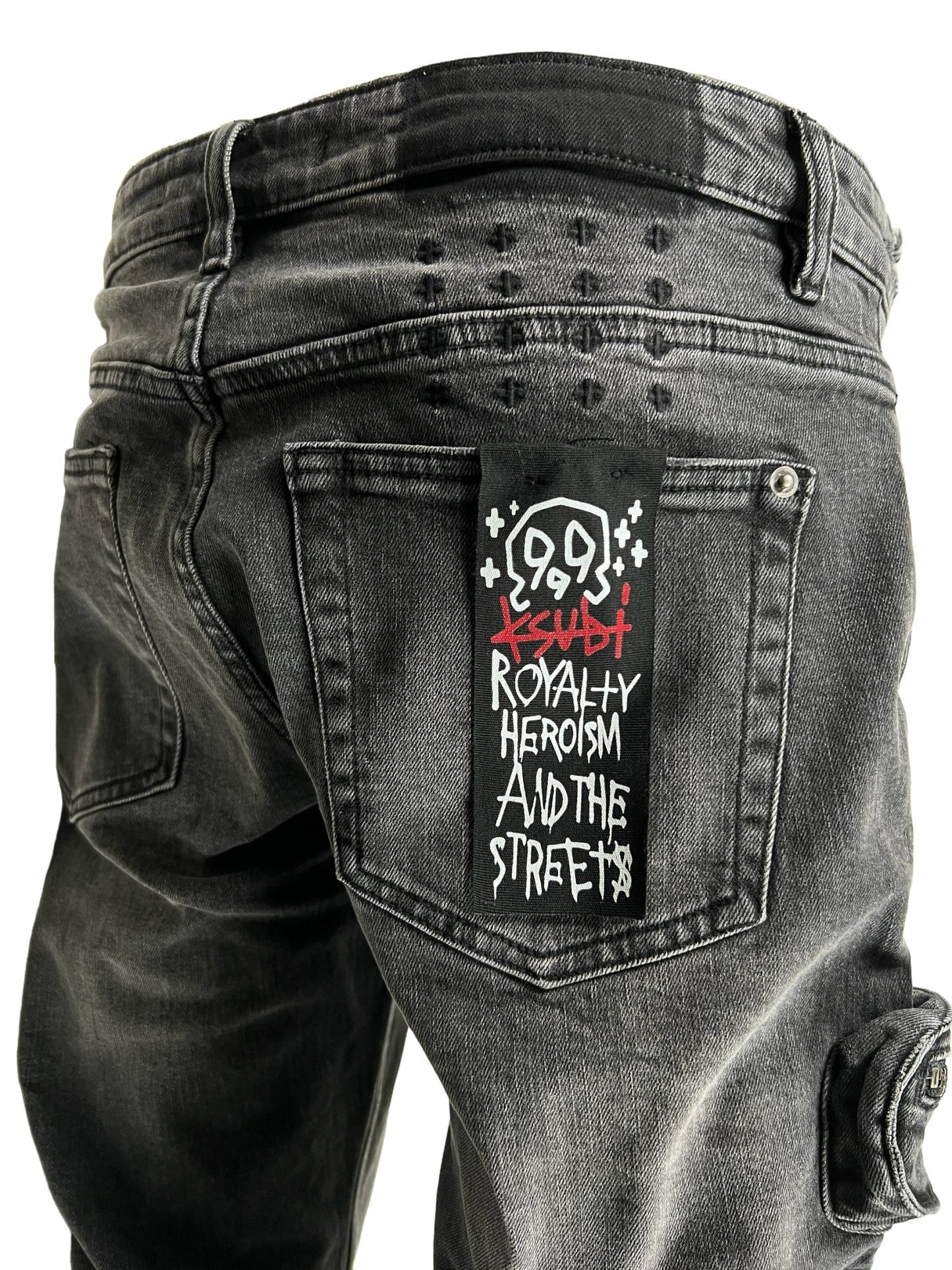 The back of a pair of KSUBI 999 Bronko Cargo Jeans Black with Ksubi x JuiceWrld embroidery branding on it.