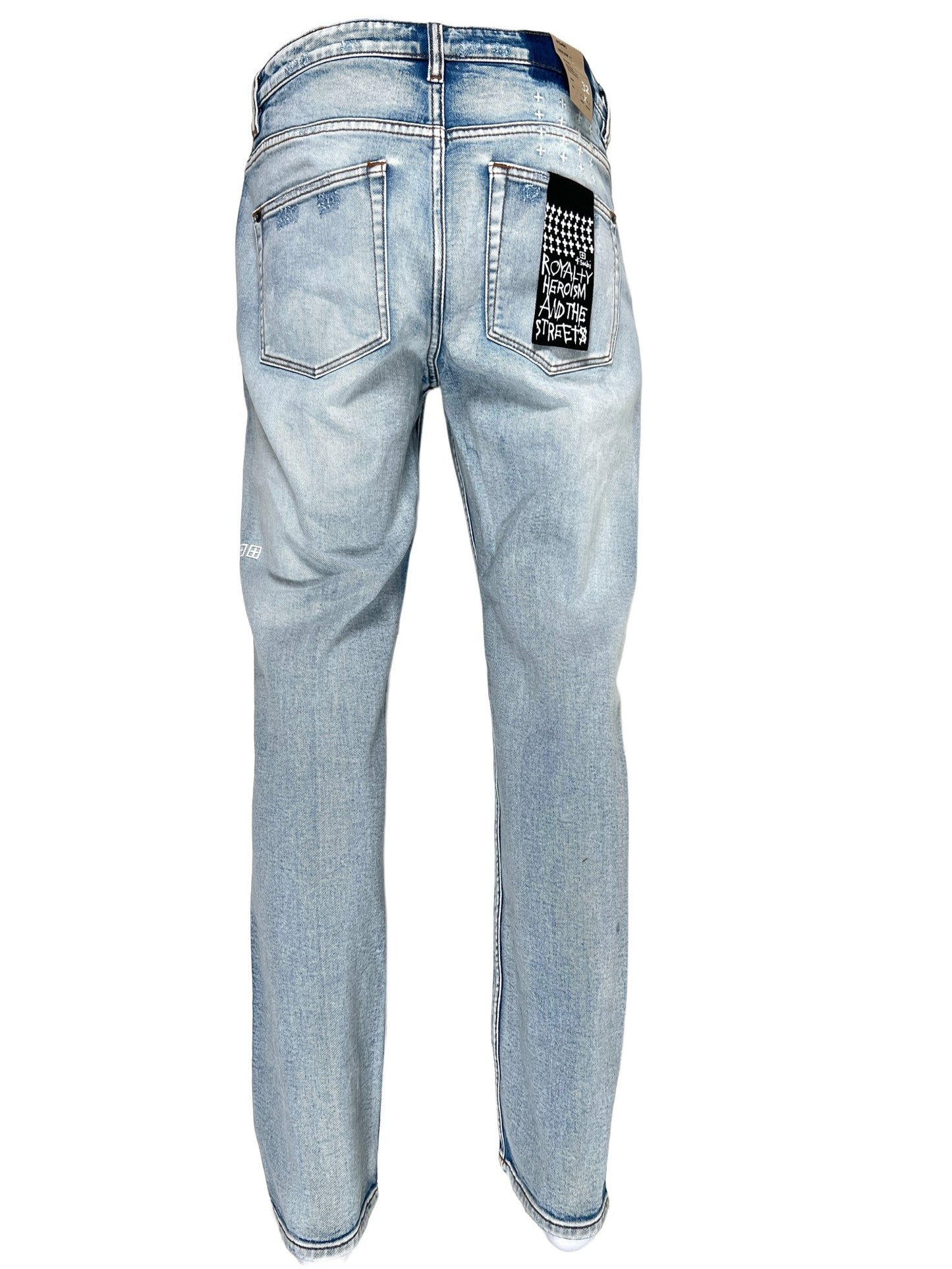A pair of men's ripped jeans with KSUBI HAZLOW CITY HIGH TRASHED DENIM tag on the back.