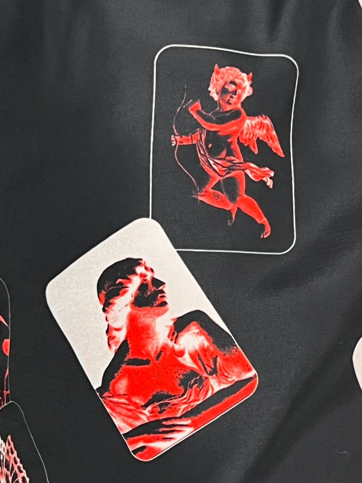 A black KSUBI ICONS BOARDSHORT shirt with red and black print on it.