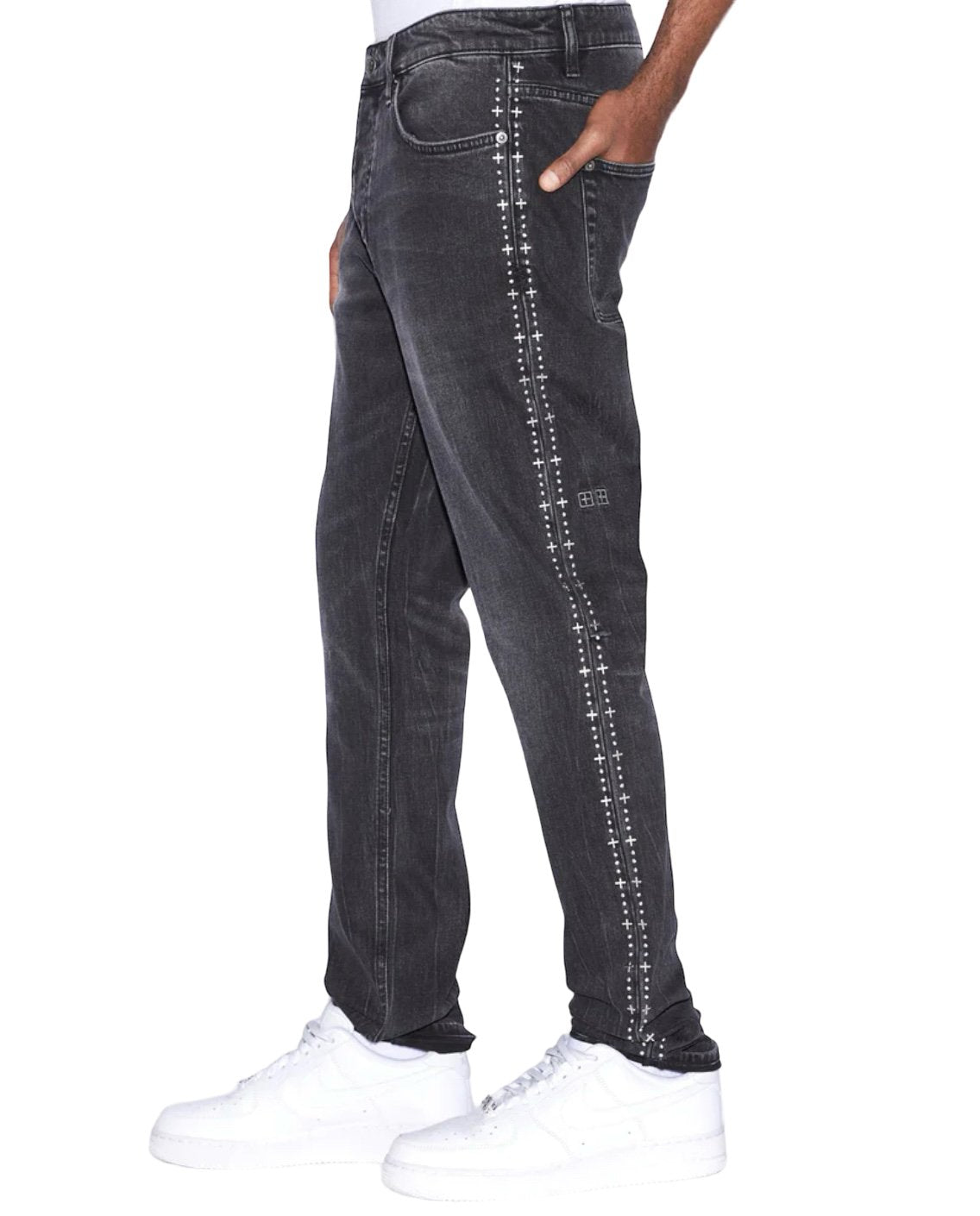 A man wearing a pair of Ksubi Jeans Chitch Metalik Stripe Black and white sneakers.