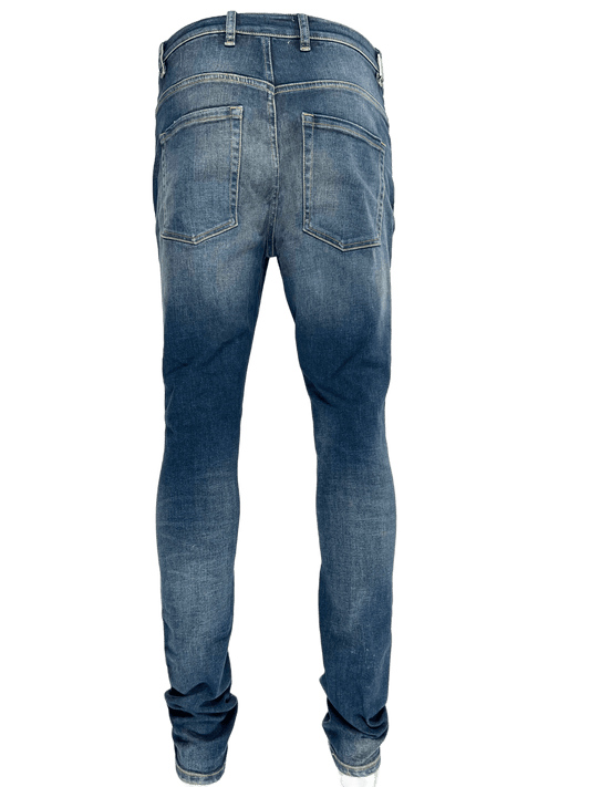 The back view of a man's REPRESENT M07044 DESTROYER DENIM DARK BLUE jeans.