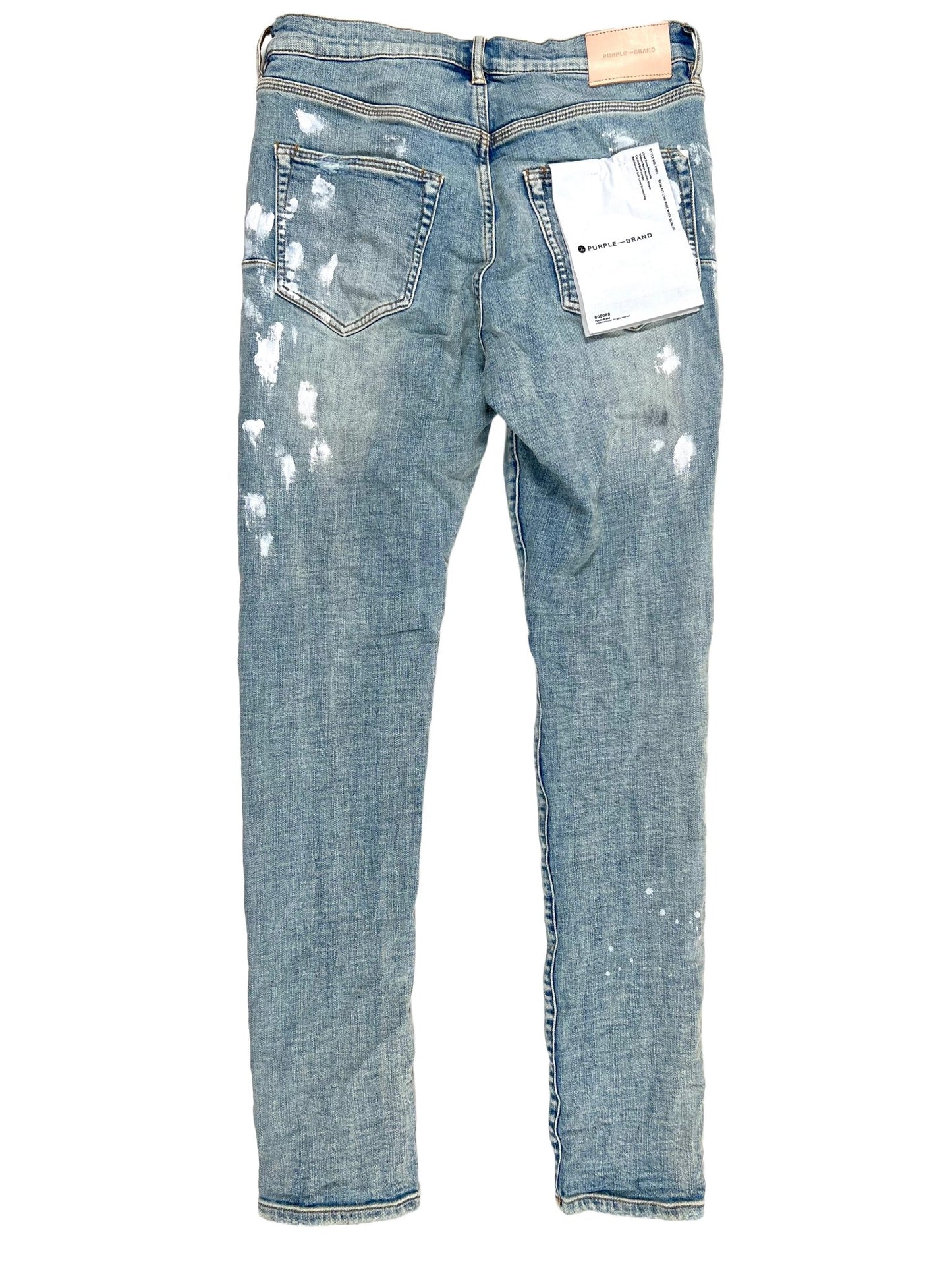 A pair of Purple Brand Jeans P001-LIA Light Indigo Paint Blowout with white spots on them.