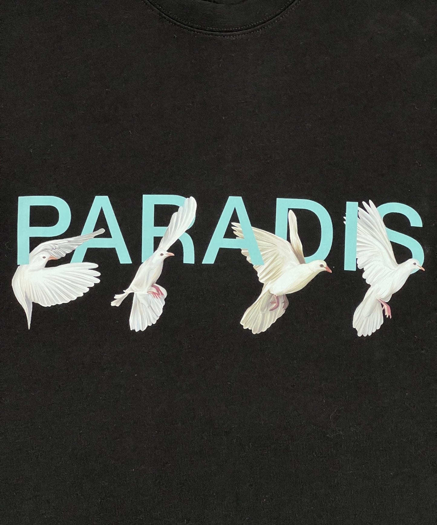 A 3.PARADIS black t-shirt with the word "Paradis" on it.