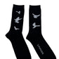 A pair of black socks with 3.PARADIS FREEDOM DOVES on them.