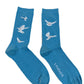 A pair of 3.PARADIS Freedom Doves Socks in Sky Blue, featuring white doves in flight and the brand's name stylishly emblazoned on one sock.