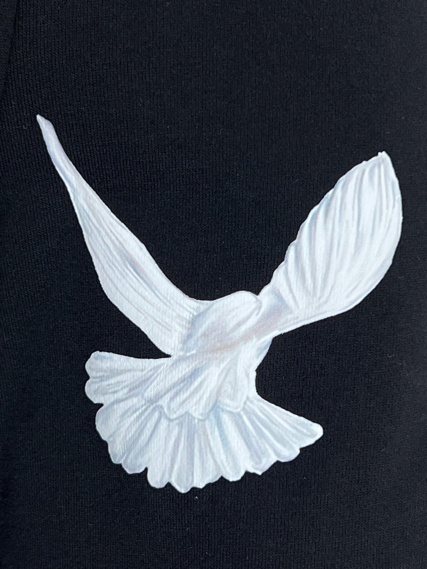 A 3.PARADIS black t-shirt with a white dove embroidered on it.