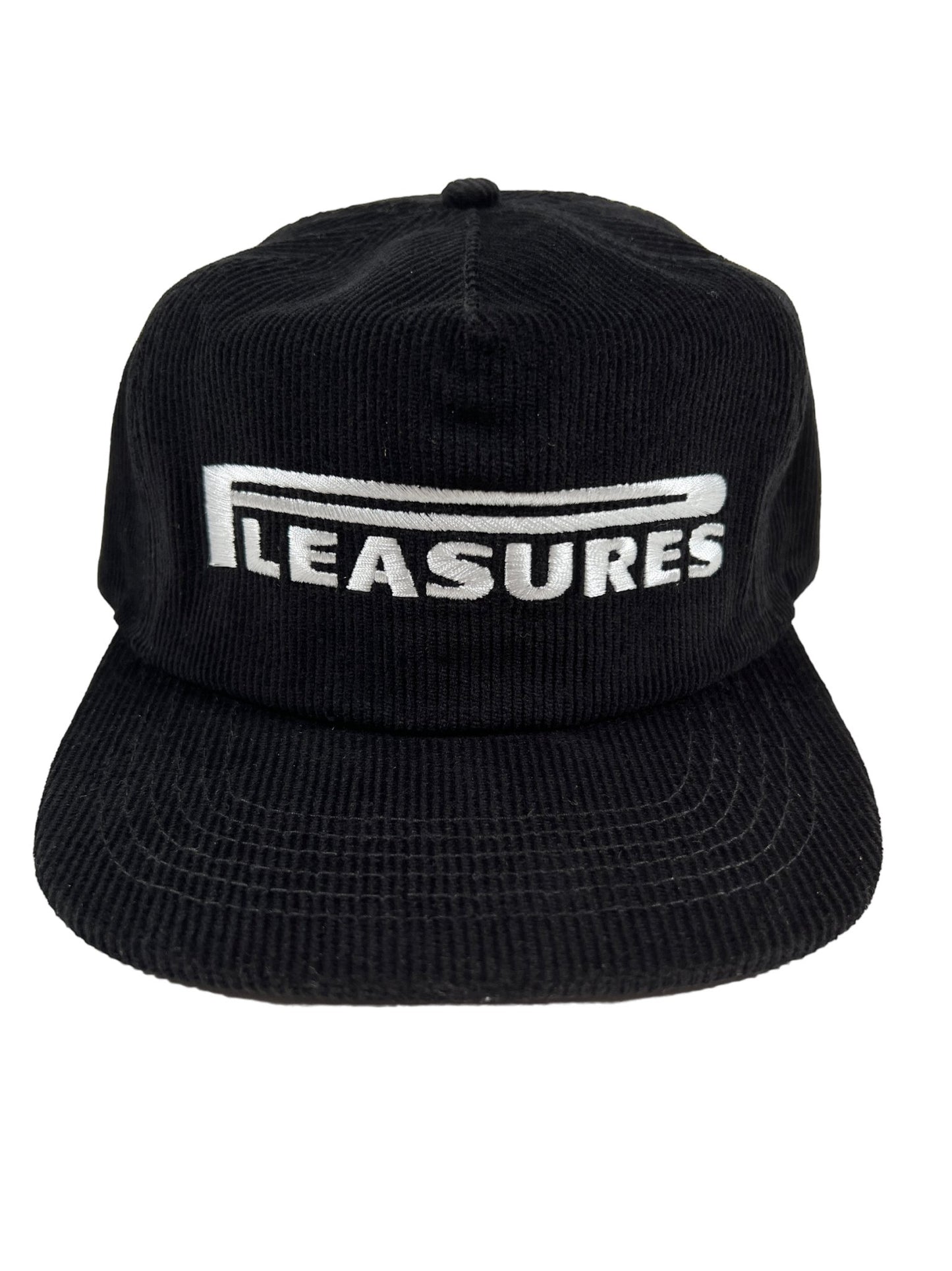 A black cotton corduroy PLEASURES PIT STOP CORDUROY HAT BLK with the word "pleasures" embroidered on it.