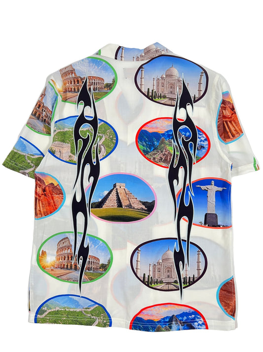 A PLEASURES 7 Wonder Camp Shirt with images of the world's most famous landmarks, featuring brown horn buttons.
