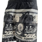 A PLEASURES black and white men's relaxed fit swim shorts with an image of a skeleton and palm trees.