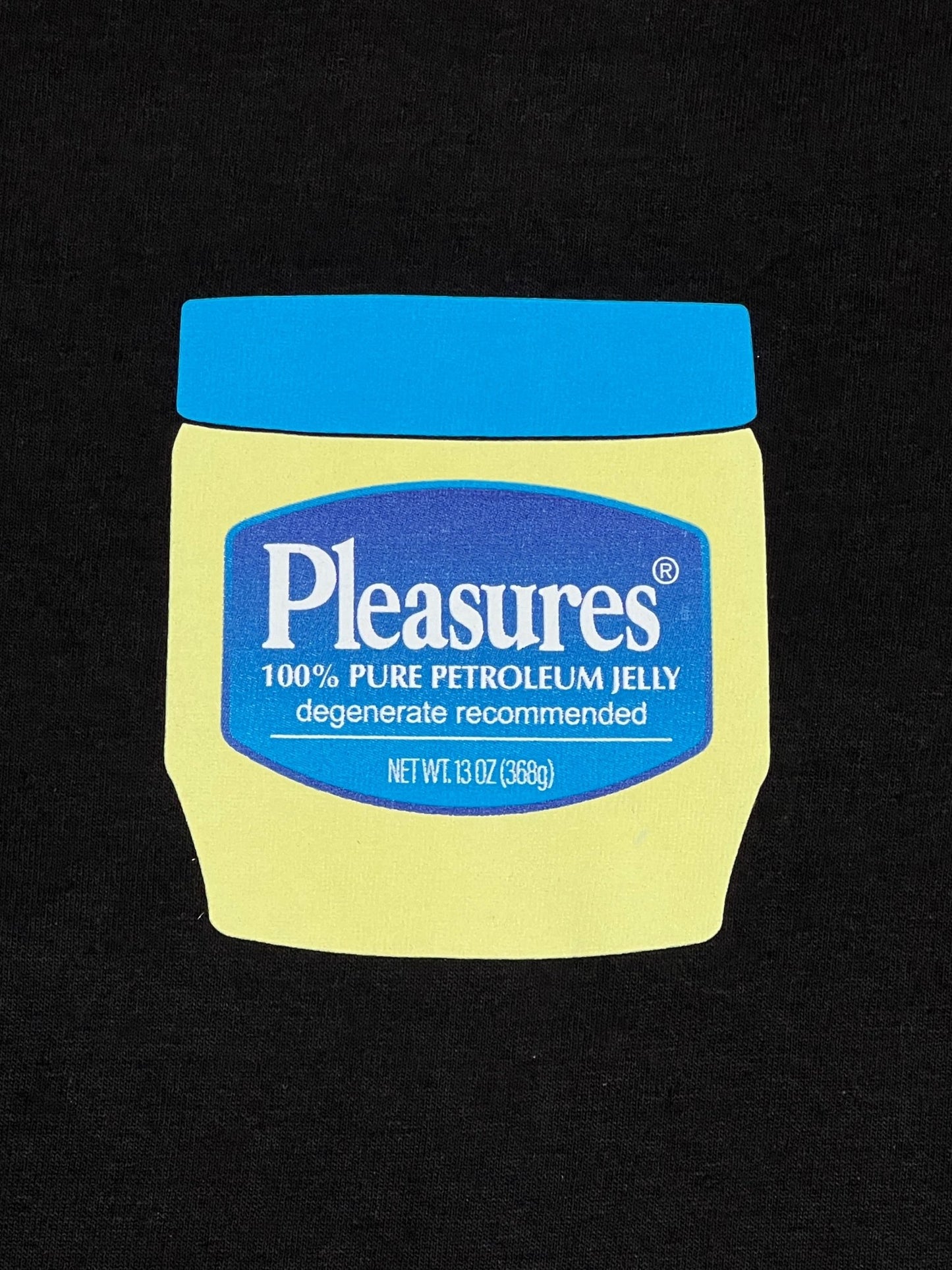A jar of PLEASURES on a stylish, comfortable PLEASURES JELLY T-SHIRT BLACK.