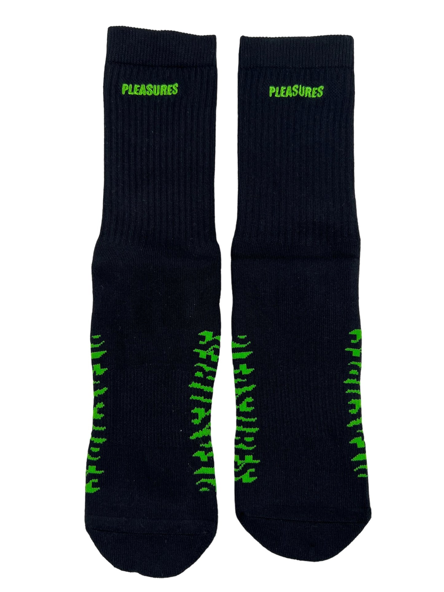 A pair of PLEASURES Knock Out Socks in black with green letters on them.