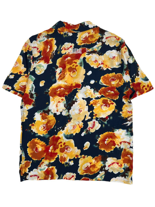 A PLEASURES PORTION BUTTON DOWN NVY adorned with a floral print.