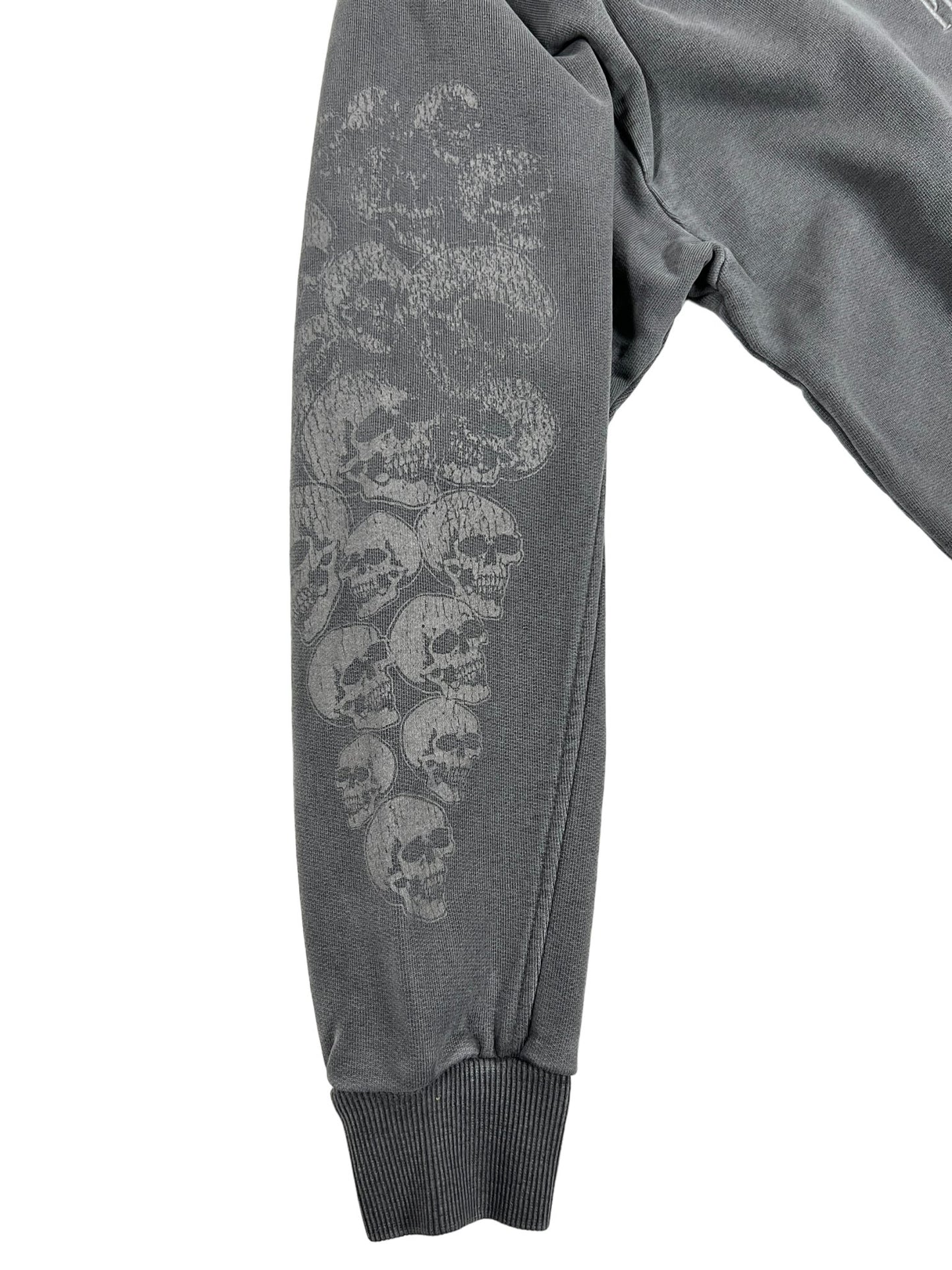 A grey cotton sweatshirt with embroidered PLEASURES SKULL SPIRAL on it.