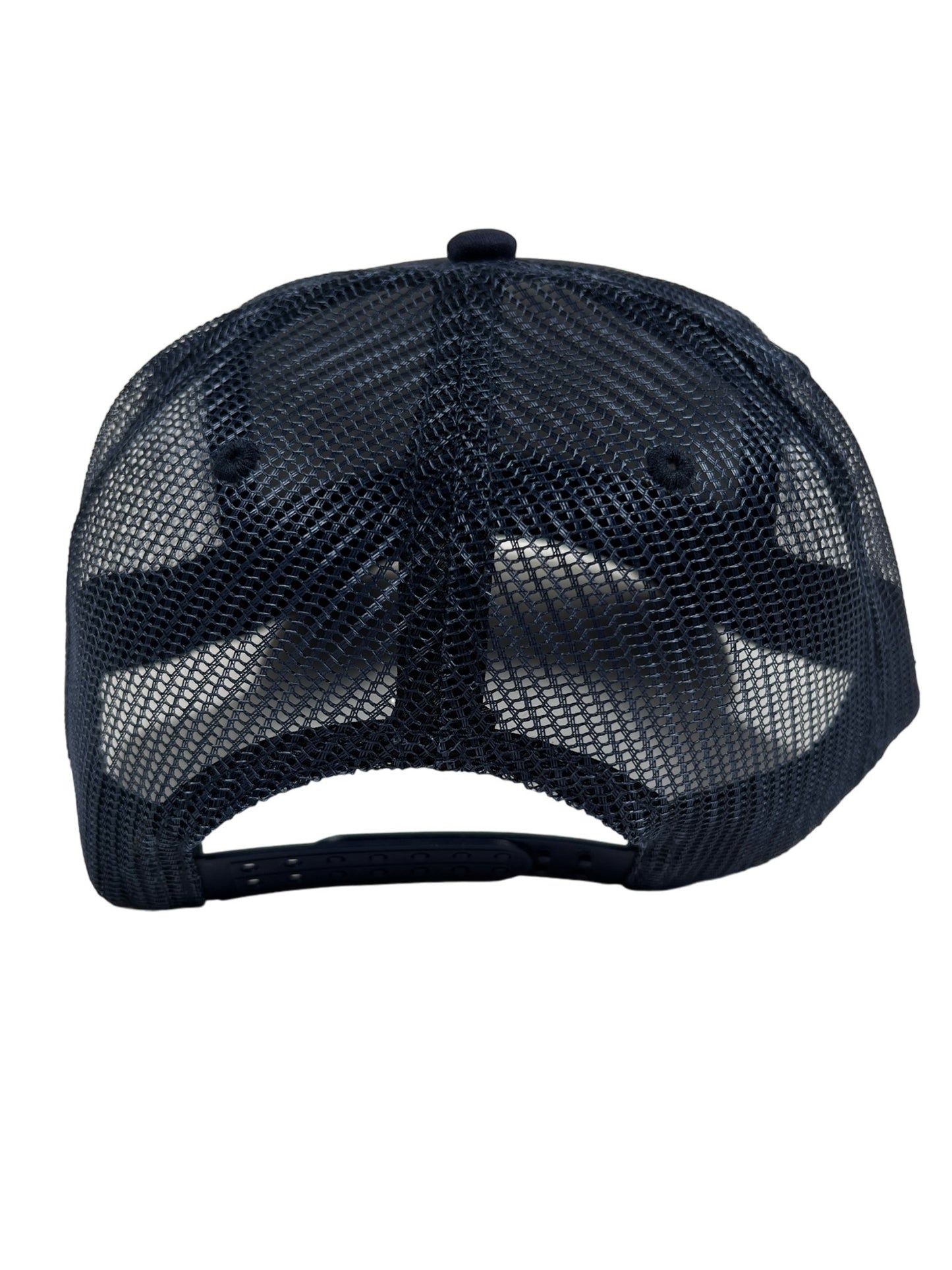 The back view of a PLEASURES navy nylon mesh trucker hat with an adjustable snapback.