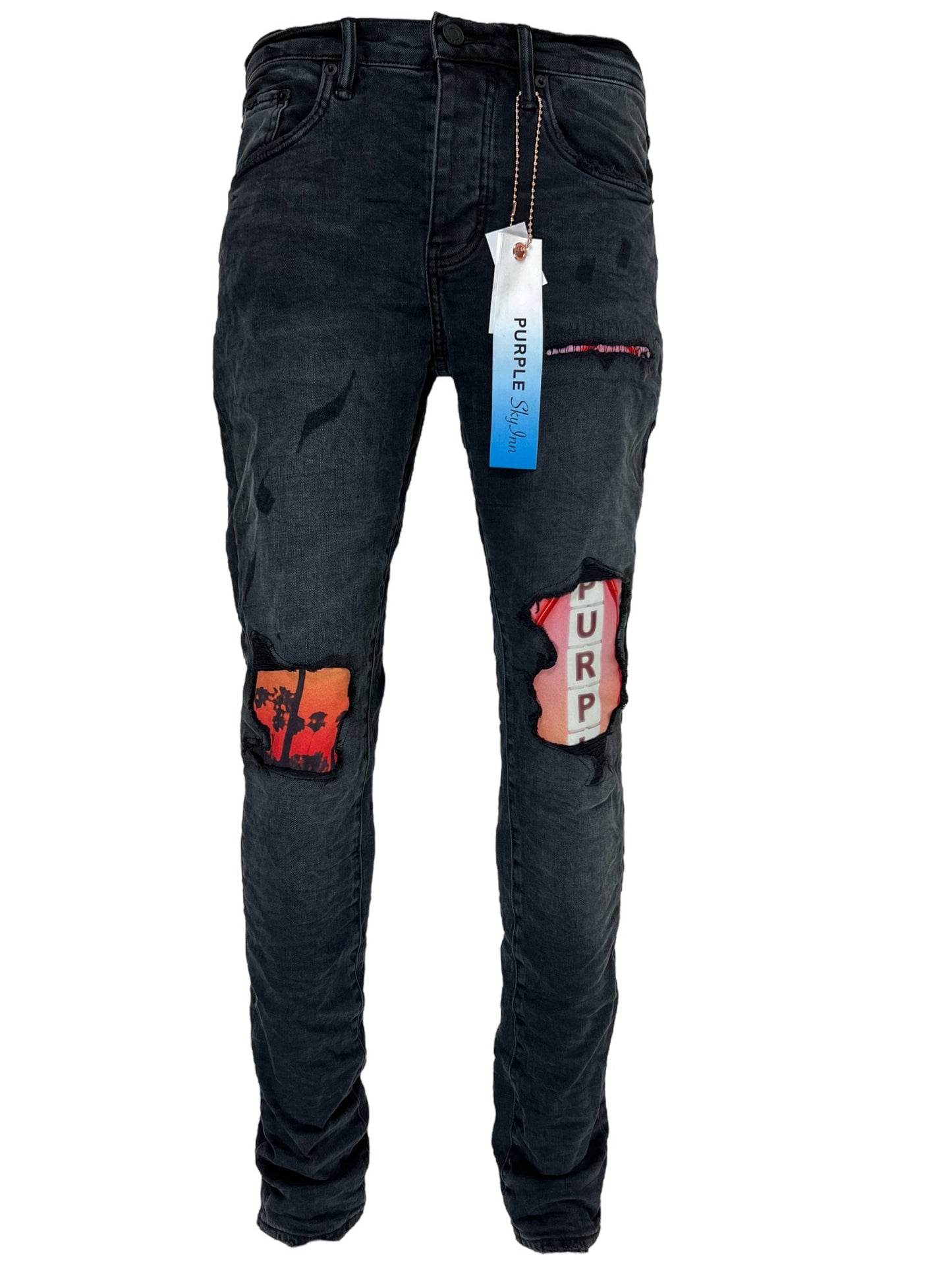 A pair of PURPLE BRAND men's skinny jeans with patches on them.