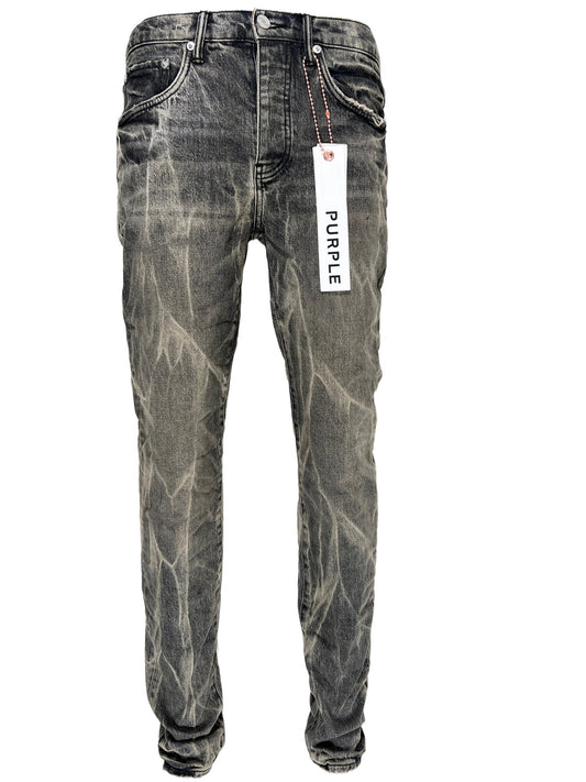 A pair of PURPLE BRAND JEANS P001-WBTA WASHED BLACK TIE ACID men's jeans with a tag on them.