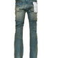 The back view of a pair of PURPLE BRAND P004-FDVA FLARED VINTAGE AFTERGLOW MID INDIGO jeans on a white background.