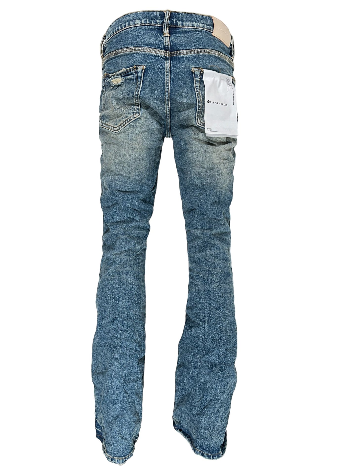 A pair of Purple Brand P004-PRFL Patch Repair Flare Mid Indigo stretch denim jeans with a pocket on the back.