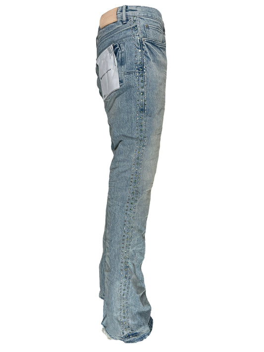 Pair of PURPLE BRAND P004-VNSL VINTAGE FLARE LIGHT INDIGO wash jeans standing upright without a person inside them.