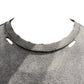 Close-up of a distressed black tee with frayed edges and holes around the neckline, showcasing Purple Brand's P101-JFBB relaxed fit crafted from premium jersey knit.