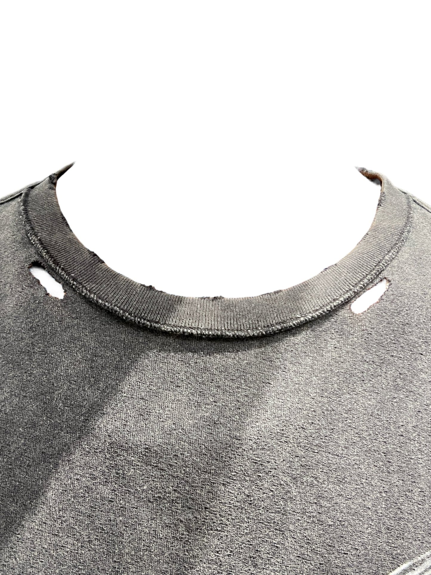 A black textured inside out tee by PURPLE BRAND with a hole in it.