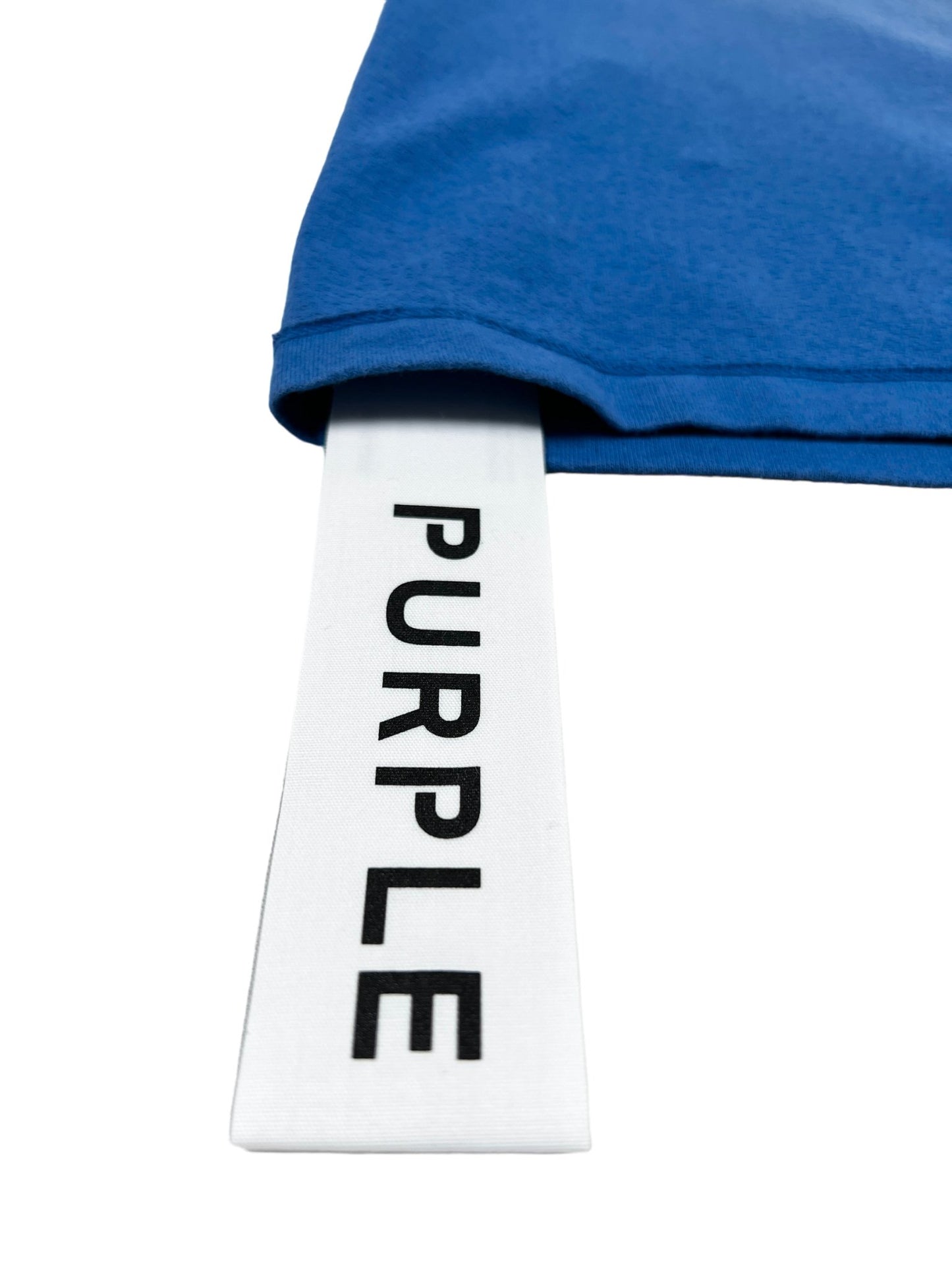 A PURPLE BRAND P101-JUCB TEXTURED INSIDE OUT TEE BLUE with the word "purple" on it.
