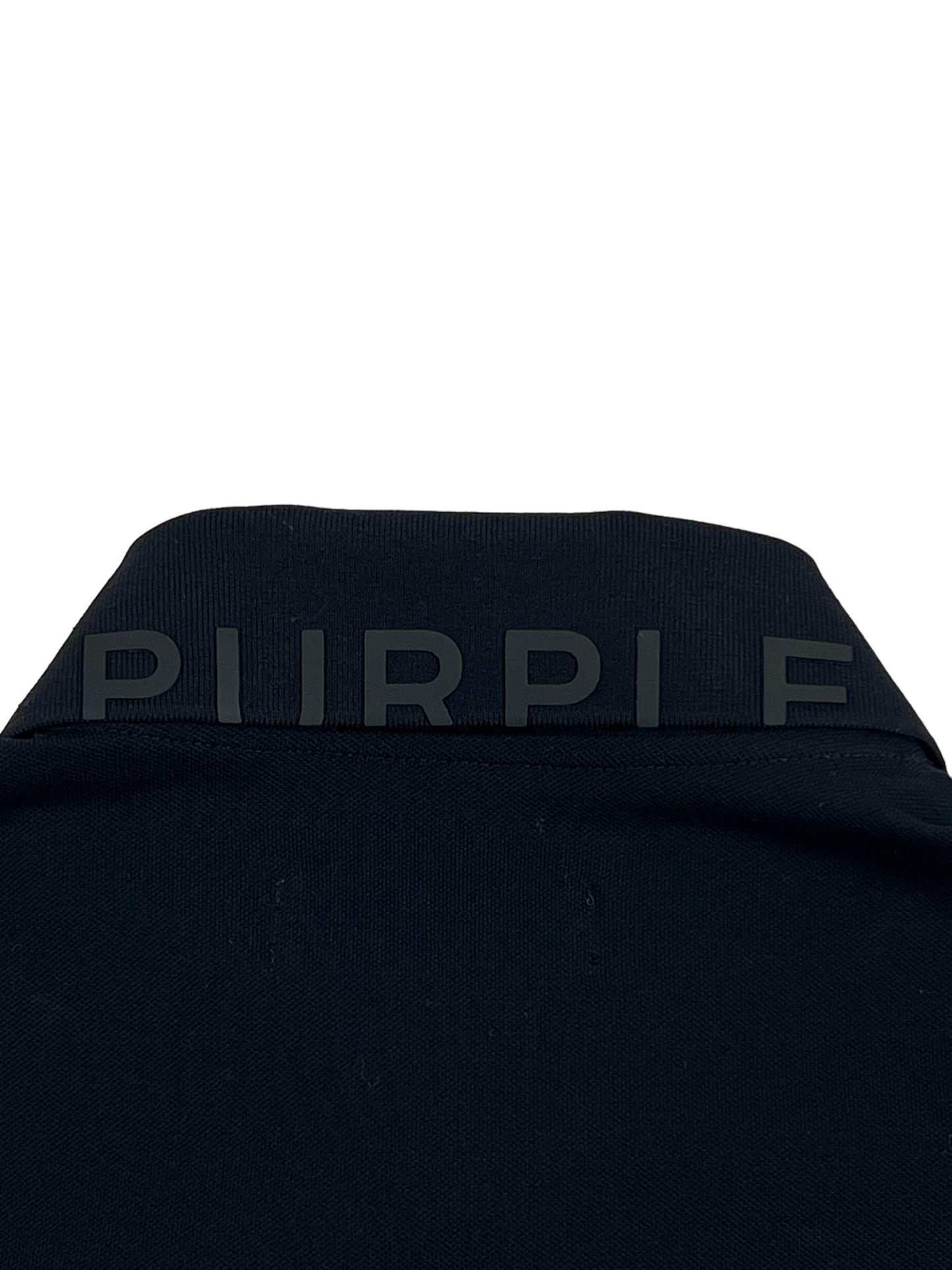 The back of a PURPLE BRAND P125-MPBP PIQUE KNIT POLO BLACK with the word purple monogrammed on it.