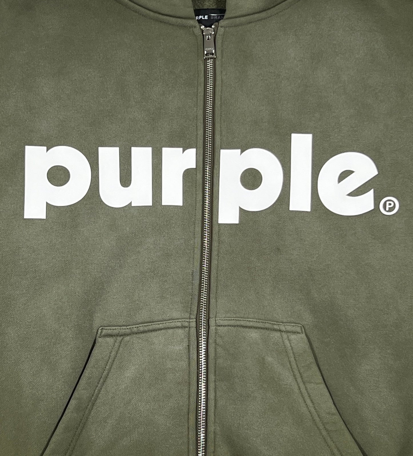 An olive green zip-up hoodie with the word "PURPLE BRAND" on it.