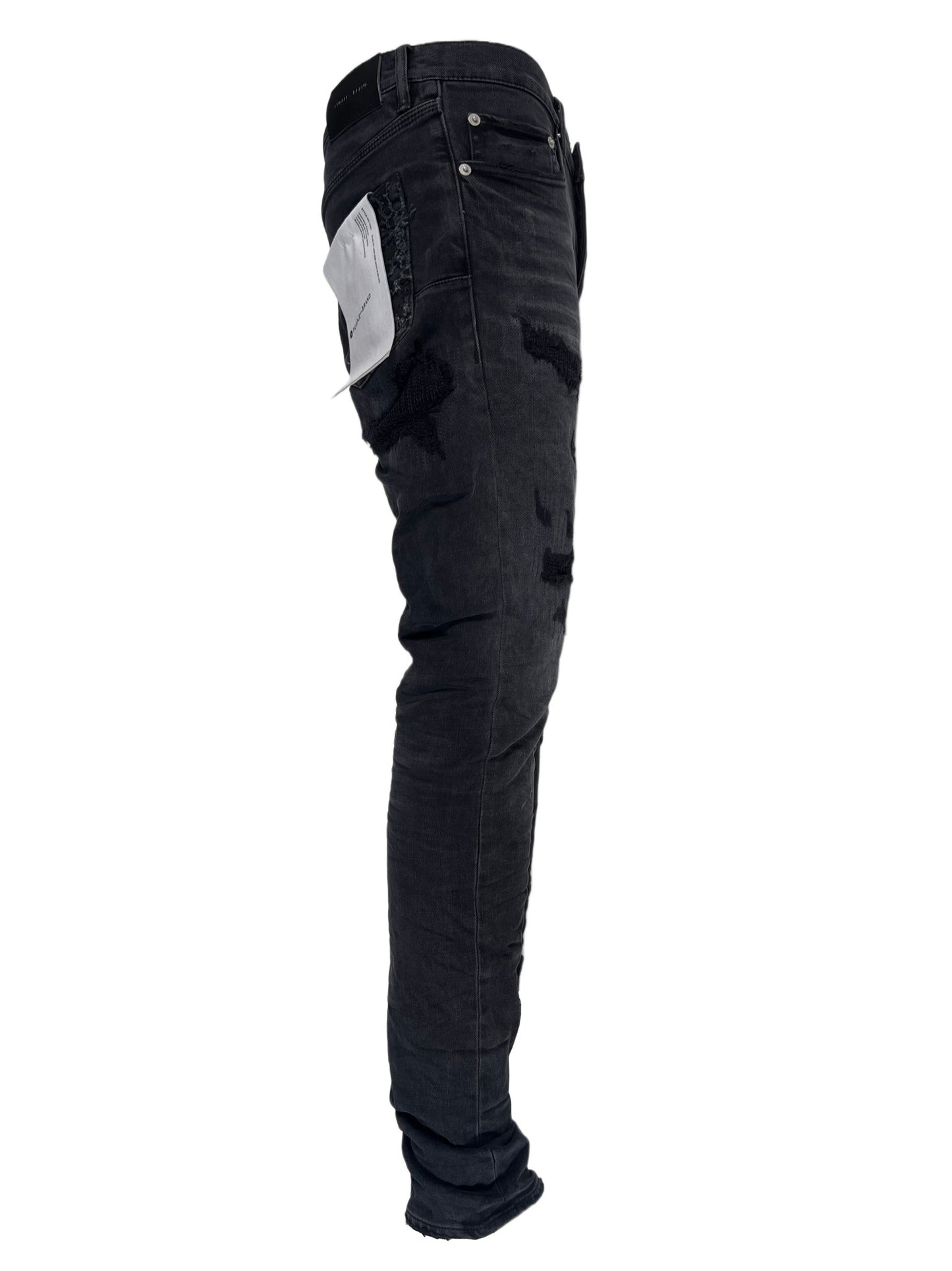 A pair of PURPLE BRAND JEANS P001-BQDP BLACK QUILTED DESTROY PKT with a pocket on the back.