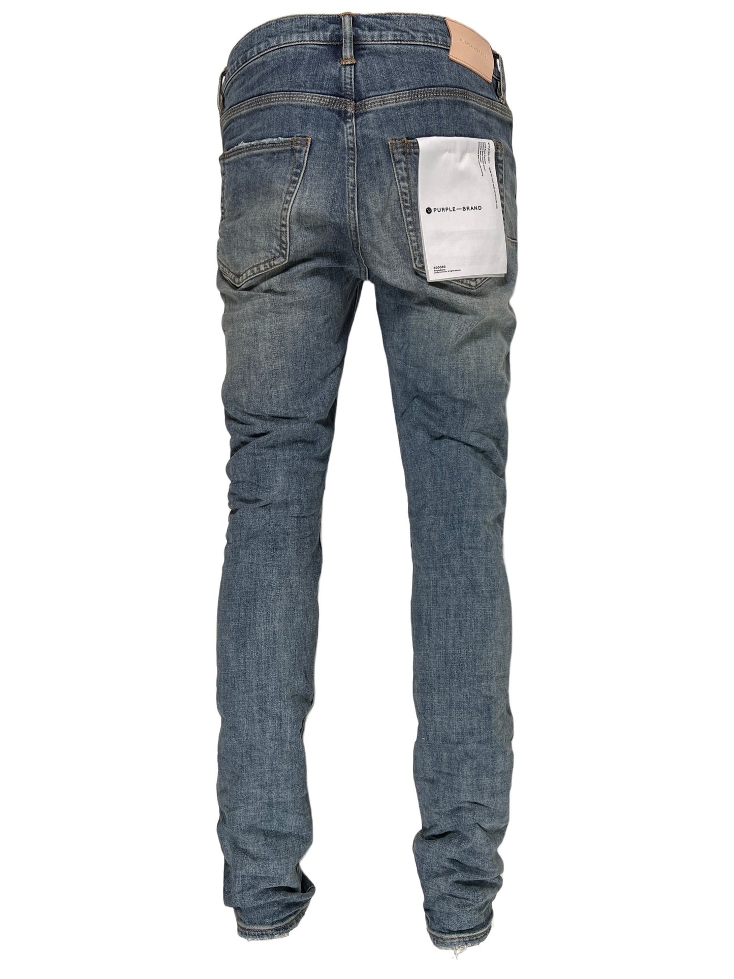 A pair of PURPLE BRAND JEANS P001-WLIB WORN LIGHT INDIGO BLOWOUT with a white tag on the back from PURPLE BRAND.
