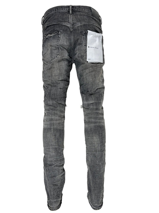A pair of PURPLE BRAND P002-GEB grey dirty blowout jeans with a pocket on the back.