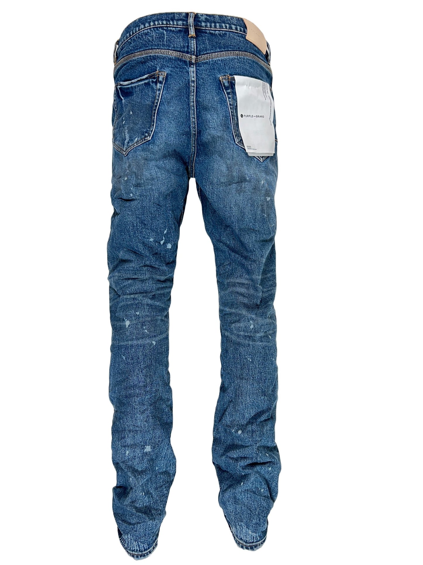 The back view of a pair of Purple Brand P005-VDDP Vintage Dirty Patch Mid Indigo blue jeans.
