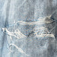 Close-up of the Purple Brand P504-PIDD All Round Short Water Print in Light Indigo, highlighting its rustic charm with visible frayed and torn sections.