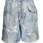 The Purple Brand P504-PIDD All Round Short Water Print in light indigo features a faded wash, elastic waistband, several rips, and a single flap back pocket.