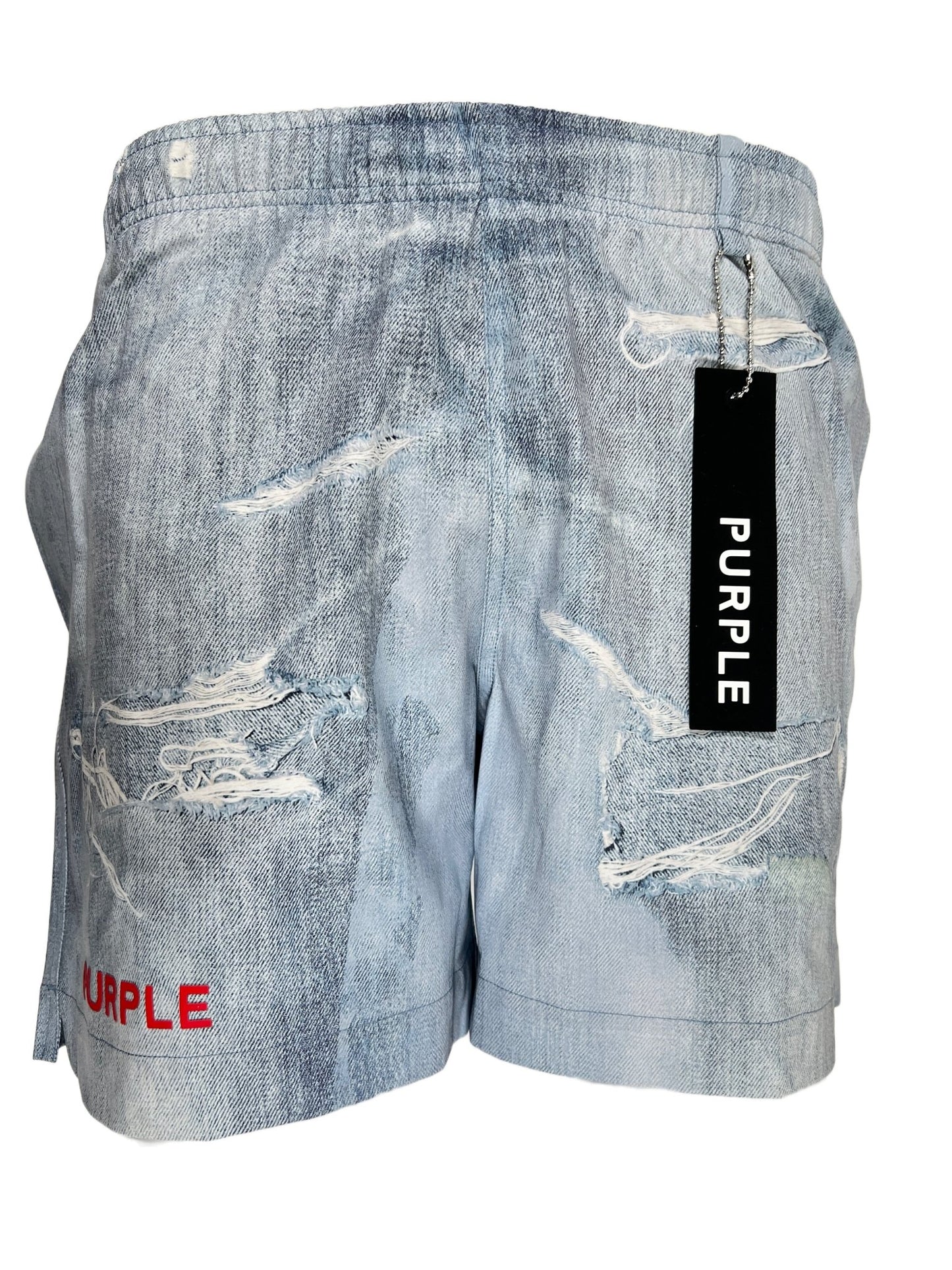 A pair of PURPLE BRAND P504-PIDD ALL ROUND SHORT WATER PRINT LT INDIGO denim shorts with a tag on them.