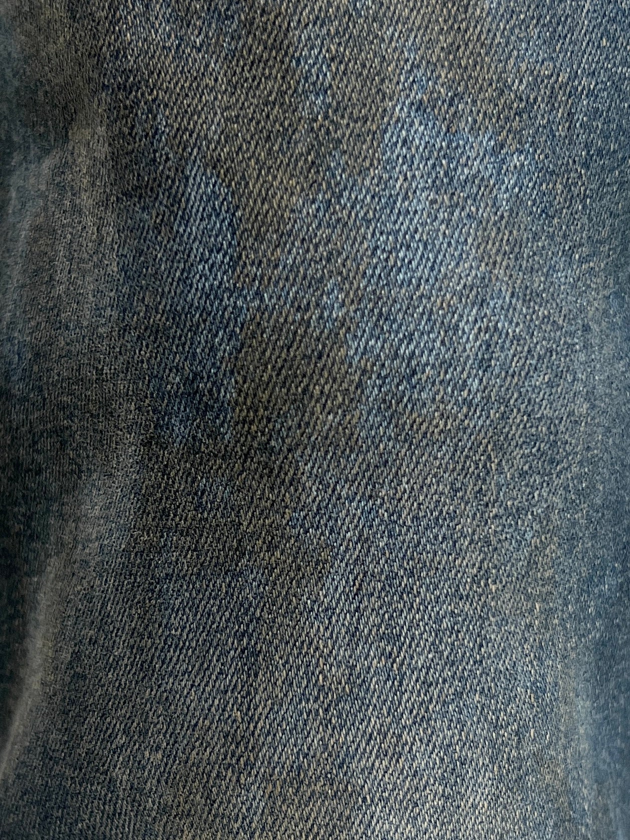 A close-up of a pair of REPRESENT M07043 ESSENTIAL DENIM STUDIO BLUE jeans.