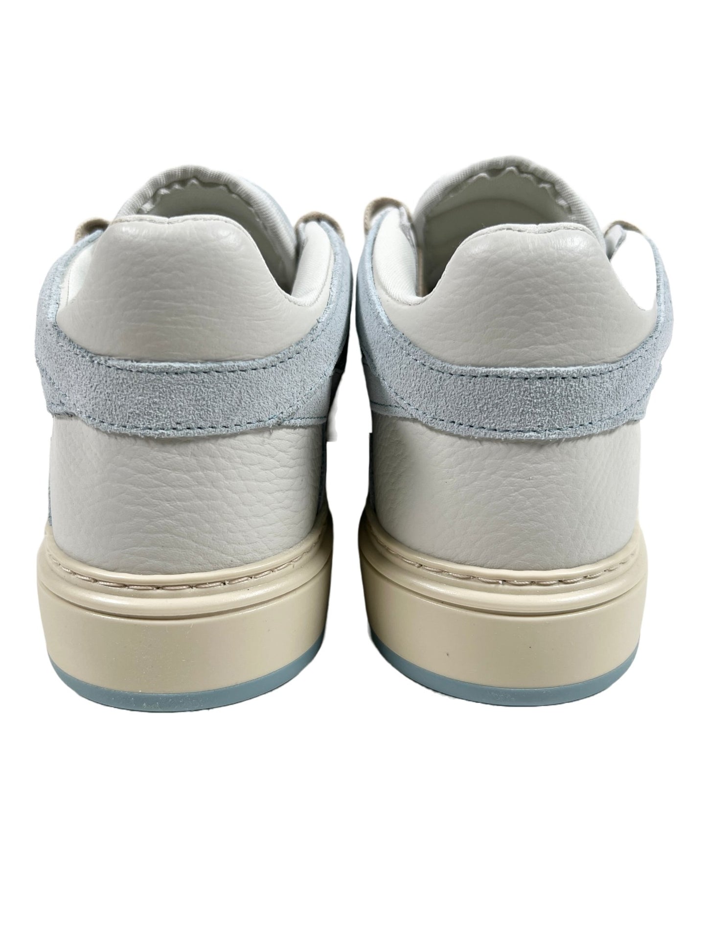 A pair of REPRESENT sneakers with blue soles, crafted from tumbled leather.