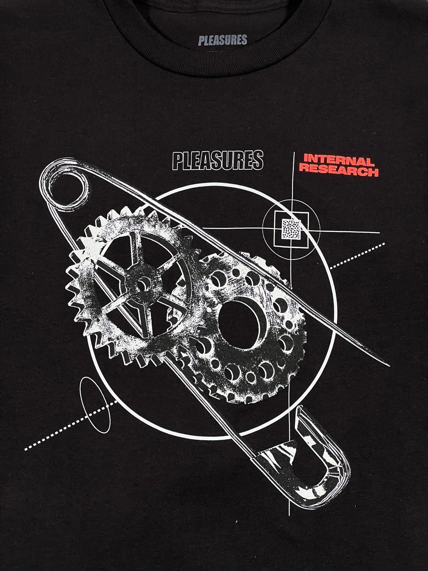 A black cotton fabric RESEARCH T-SHIRT BLACK/BLACK with a graphic design of a gear by PLEASURES.