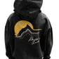 The back of a black RHUDE AWAKENING HOODIE VTG BLACK showcases an image of a mountain and a sunset with printed motifs.