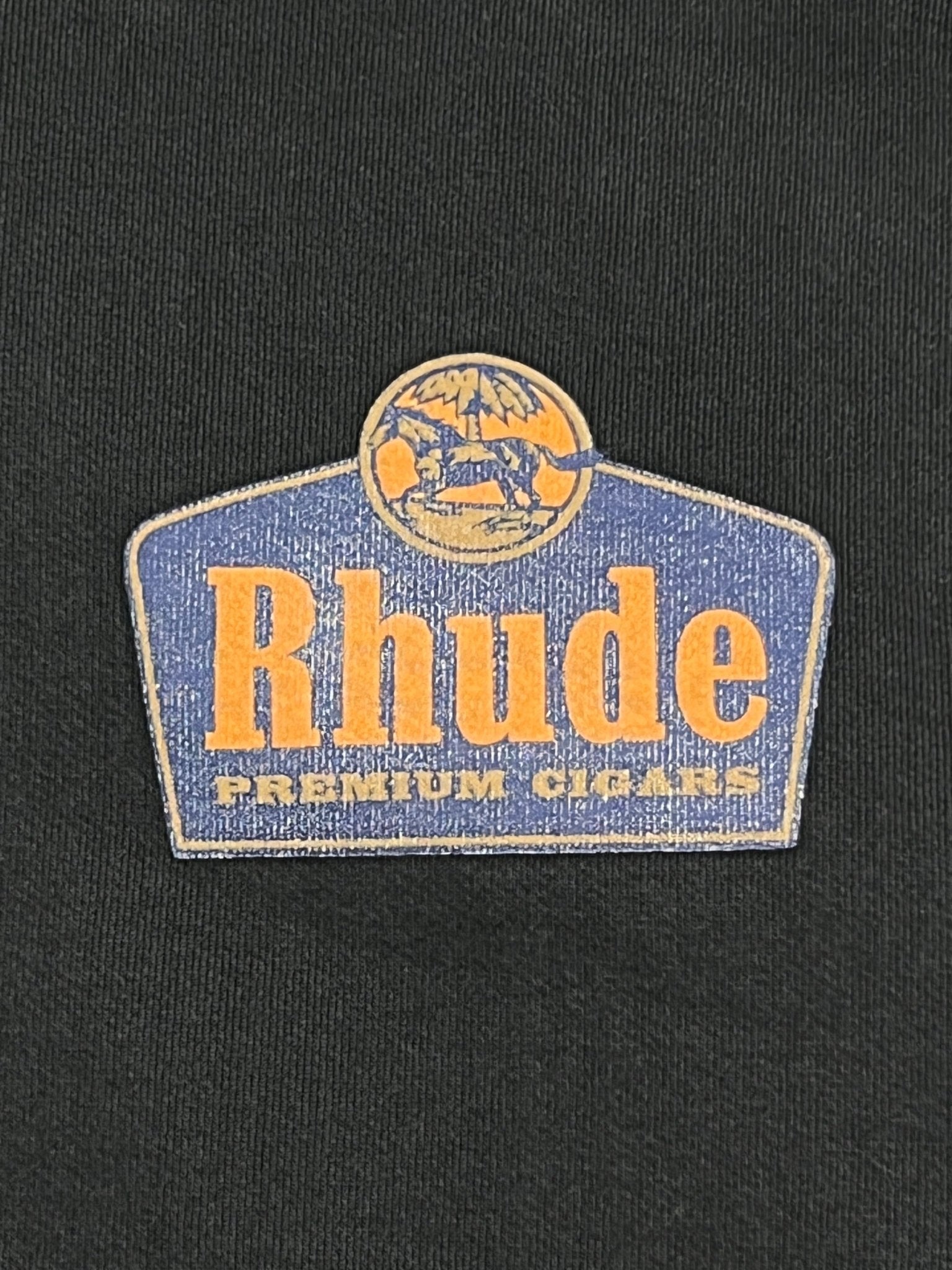 Rhude graphic logo on a RHUDE GRAND CRU HOODIE VTG BLACK.