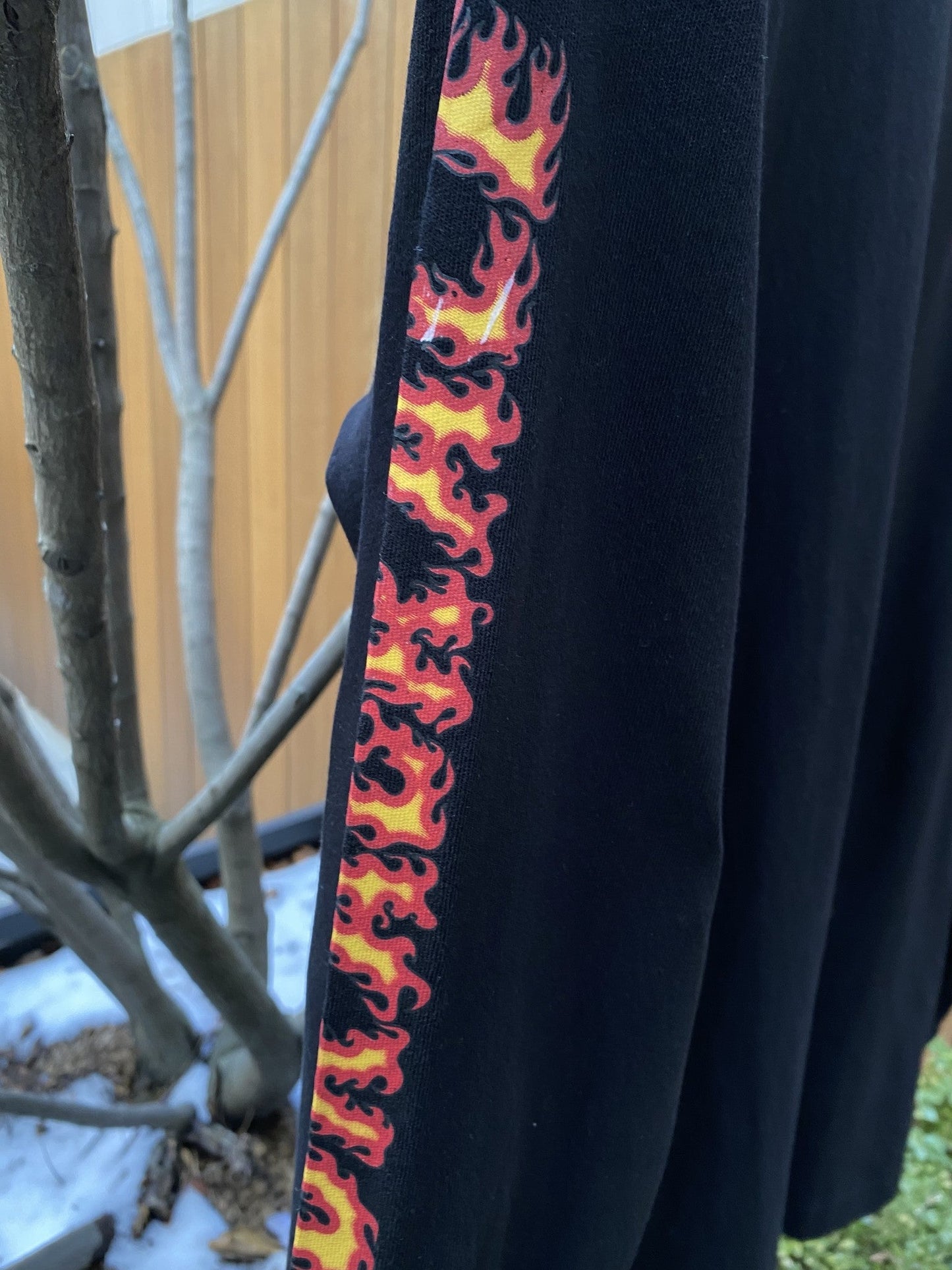 A DIESEL T-JUST-LS-C3 BLACK with flames on it from DIESEL.