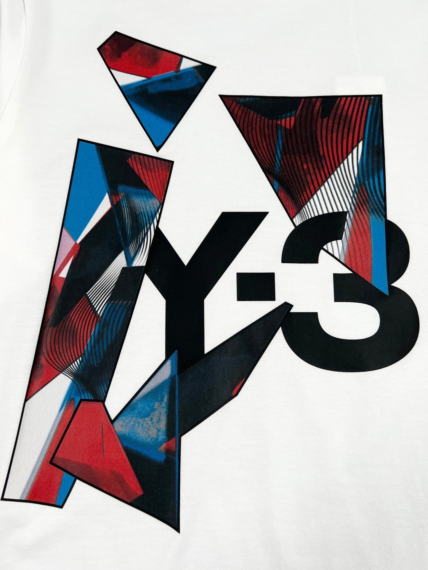 A white Y-3 T-SHIRT IL1789 GRAPHIC SS CORE WHITE with the word ADIDAS x Y-3 on it.