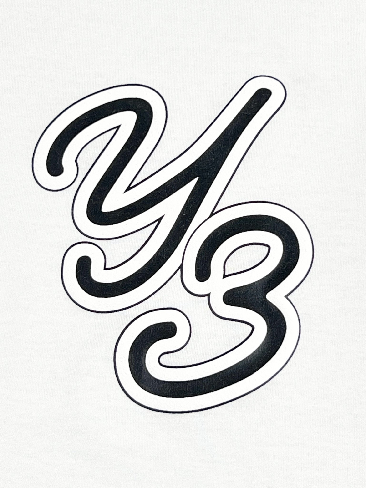 The front of the ADIDAS x Y-3 T-Shirt IT7522 Gfx SS Tee Off White features bold black "Y3" letters on a white background. Crafted from sustainable cotton, it provides a casual fit ideal for everyday use.