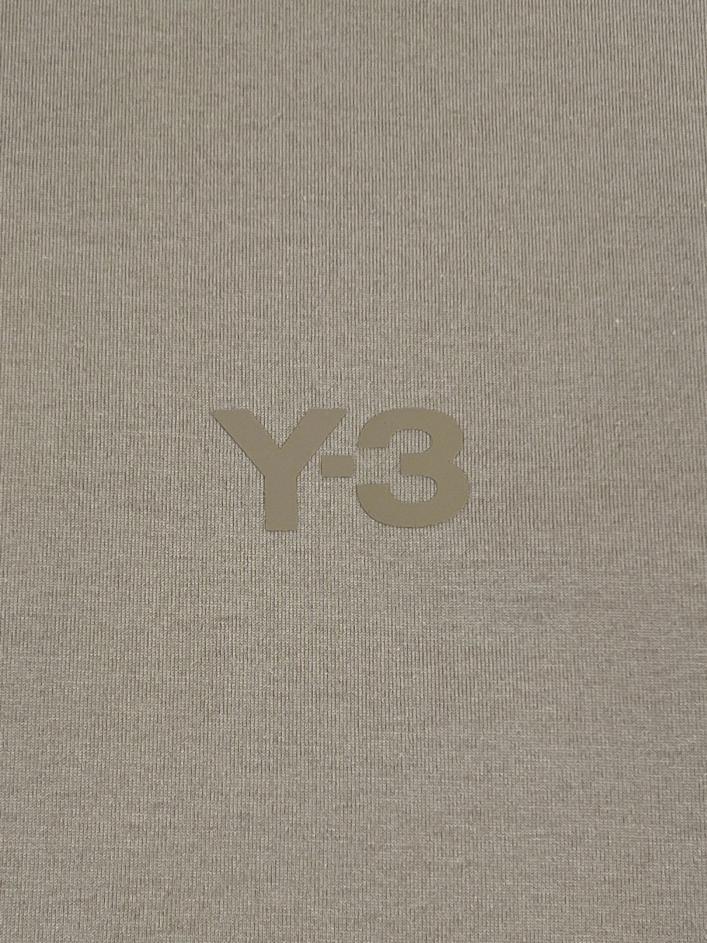 The Y-3 IV8223 RELAXED SS TEE CLABRO logo on a beige relaxed fit t-shirt by ADIDAS x Y-3.